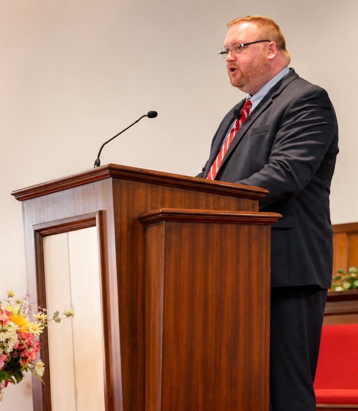 Pastor Michael R. Jones preaching from the pulpit at Zion Baptist Church